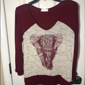 V neck top with elephant detail on the front.